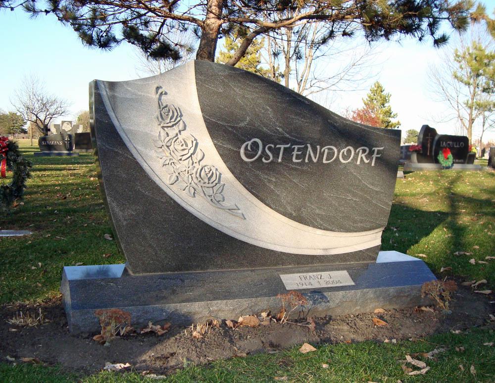 Family monument with cursive family name and roses